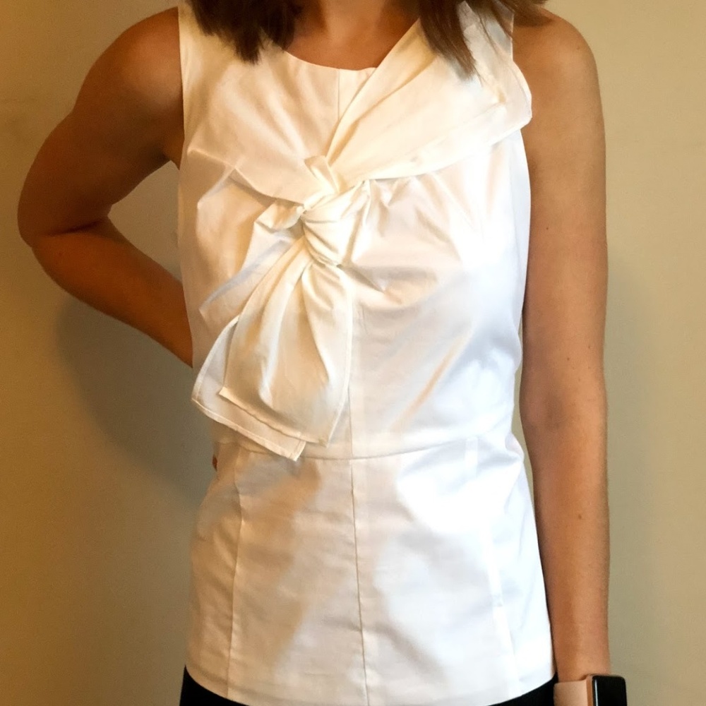 Crisp White Top with Architectural Bow Detail